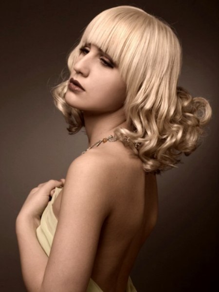 Hairstyle with platinum edged bangs that rest over the brows