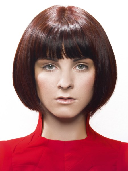 Sleek chin length bob with a rounded shape and bangs