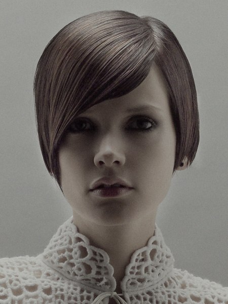 Short bob hairstyle with a long swept across fringe