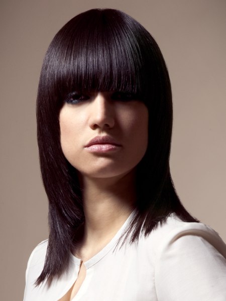 Sleek shoulder-length bob with a curved fringe