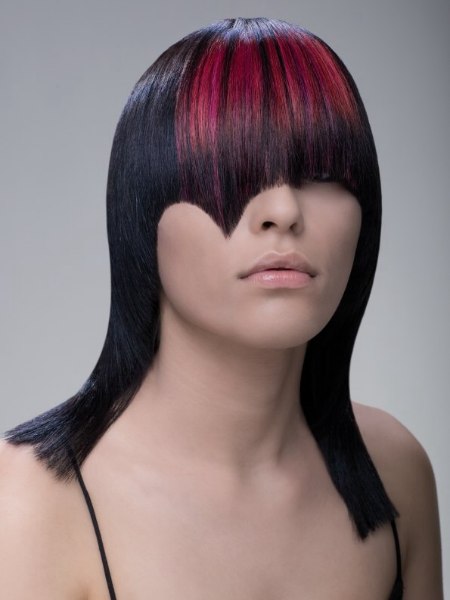 Long asymmetrical haircut in black with a red accenting color