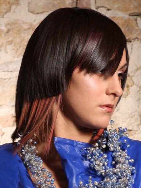 Hairstyle with an angled parting and angle-cut fringe