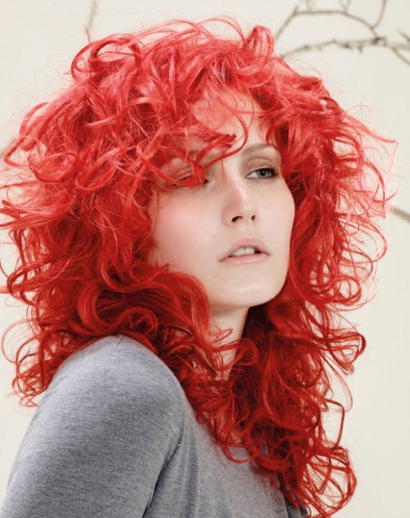 Red hair in a long feathered style