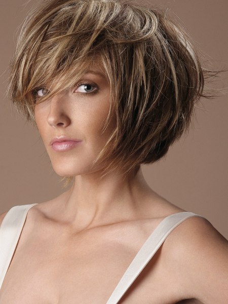 Contoured bob cut styled with scalp-lift for volume