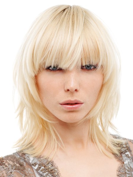 Shoulder length shag with blunt bangs