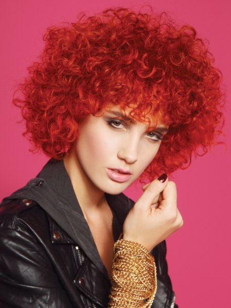 Afro inspired hairstyle with curls for red hair