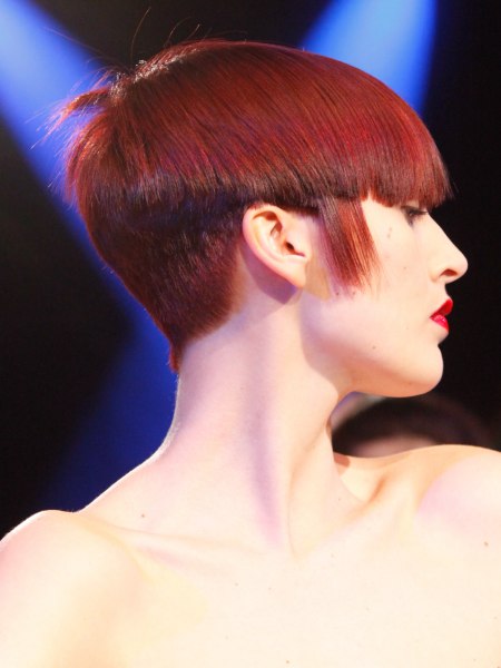 Short women's haircut with a steeply graduated neck