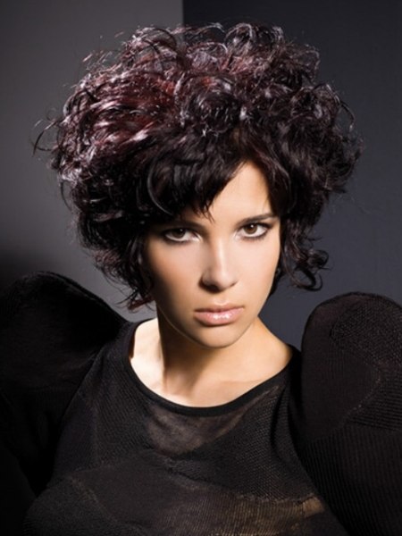Short curly hair style with a split fringe