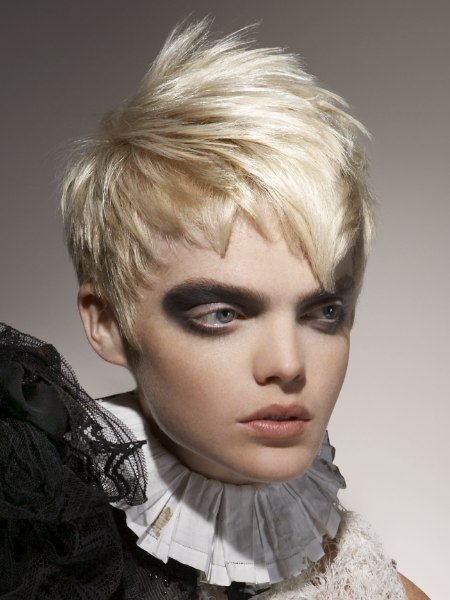 Choppy short platinum blonde hair with a spiky crown