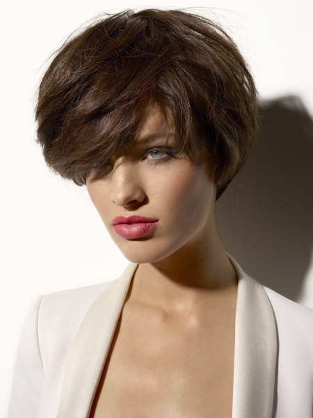 Short haircut styled with the hair flipped sideways