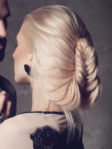 Updo with a pinned herringbone braid