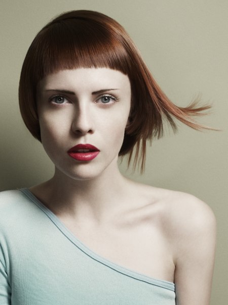 Short haircut with varying lengths and a short fringe