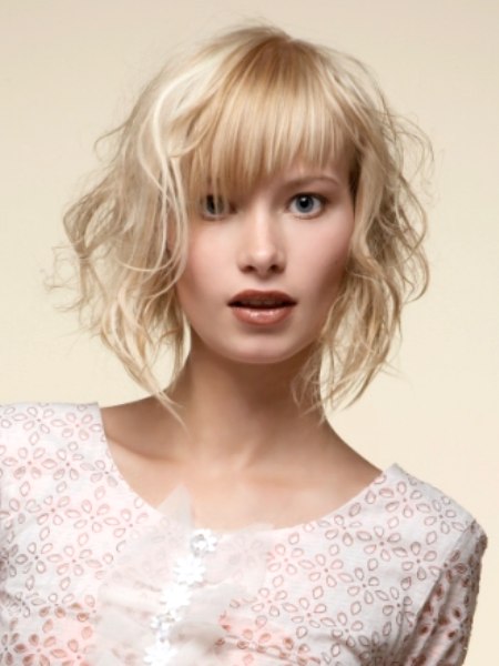 Short blonde hair with thin strands and curls