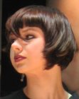 Short brunette bob with bangs and forward jutting sides