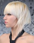 Blonde hair cut into a helmet shape