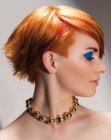 Short haircut with a wisped up back and sleek bangs