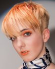 Very short orange hair with clipper cut back and sides