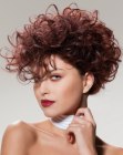 Short mahogany color hairstyle with big curls