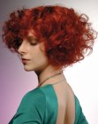 Red chin length hair with large curls