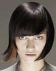 Short bob haircut with smooth bangs and a shiny surface