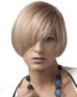 Short blonde bob with a side part and clean edges