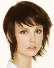 Short hair with textured layers that lies over the neck line