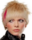 Blonde hair with a flash of fuchsia and asymmetrical bangs