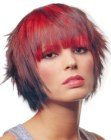 Bright red hair cut into a bob with full bangs