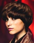 Short haircut with over the brows bangs for chestnut hair