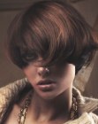 Sporty short haircut with long bangs and roundness