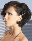 Dressy short close to the neck hairdo with a hair accessory