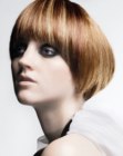 Sleek sixties inspired bob with hair that falls around the face