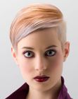 Short haircut with multiple hues and a shiny surface for modern women