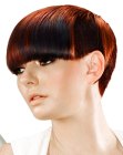 Sleek short hairstyle with bangs that touch the eyelashes
