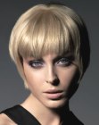 Blonde retro pixie with razor cut layers and bangs