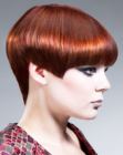 Short coppery hair with sharp angles and a pointed neckline