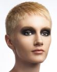 Women's haircut with short clipper cut sides and longer top hair