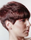 Sleek pixie cut with round graduation and bangs