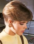 1980s women's haircut with a buzzed nape