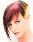 Short haircut with a buzzed nape and vivid hair colors
