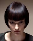 Very sleek short bob with bangs that follow the eyebrows