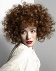 Short layered hair with corkscrew curls and bounce
