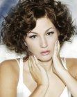 Short hairstyle with large curls and an elegant side part
