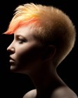 Very short haircut with contrasting elements and multiple shades