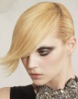 Italian short hairstyle with a dramatic side parting and long bangs