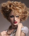 Short hairstyle with flamboyant curls and one side styled back
