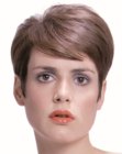 Low maintenance pixie cut with smooth styling and volume on the crown