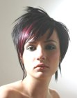 Dark razor-cut hair with purple streaks