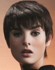 Pixie cut with length in the nape area and long bangs