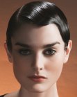 Short women's hair styled with pomade for a retro look